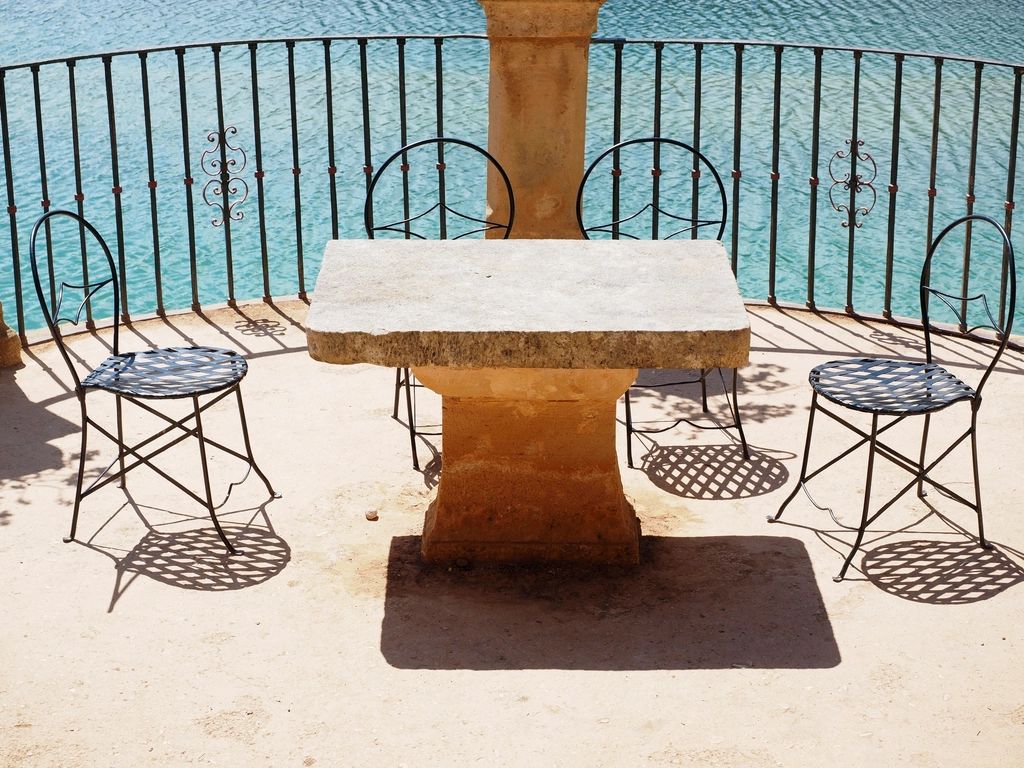 A private terrace with outdoor seating and a view